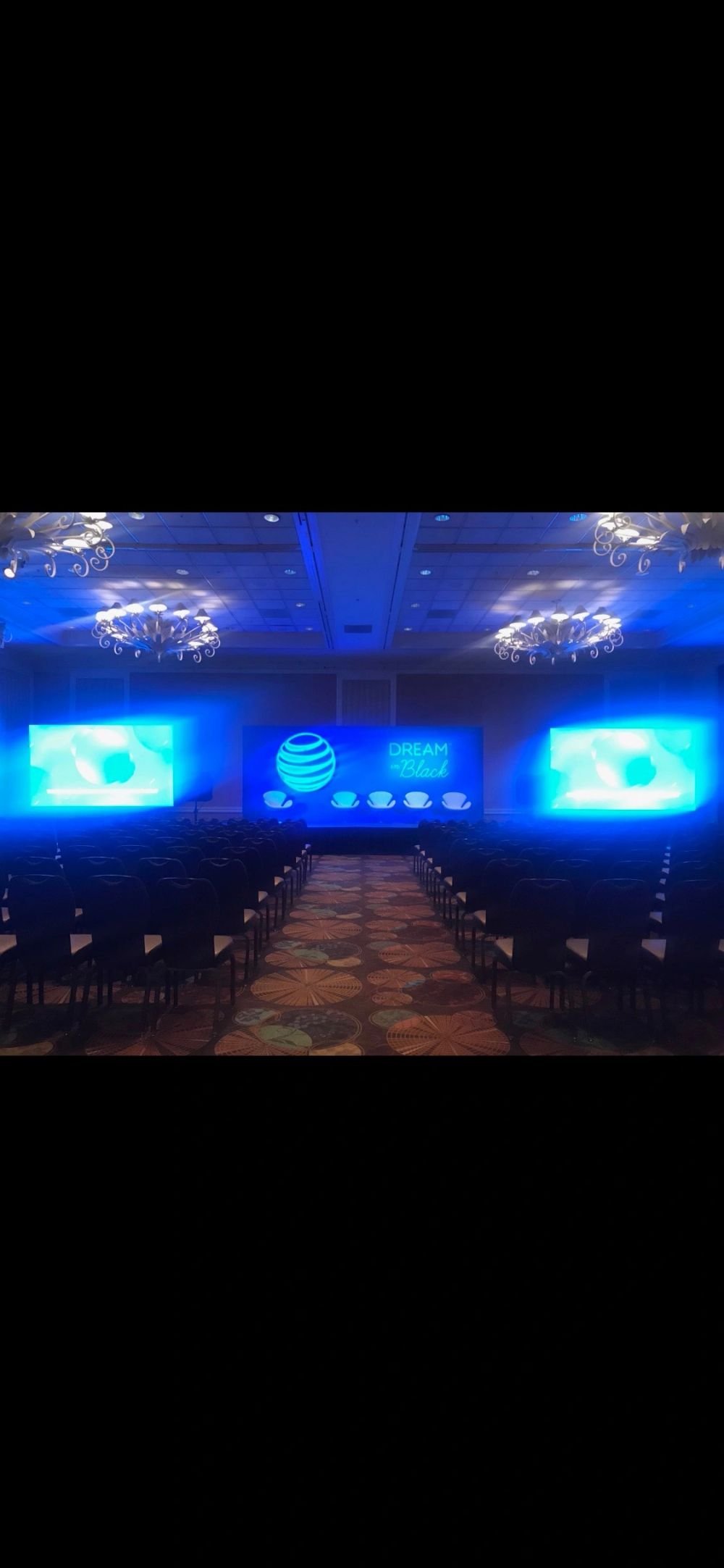 Stage wash lighting and LED screens set for a ballroom event