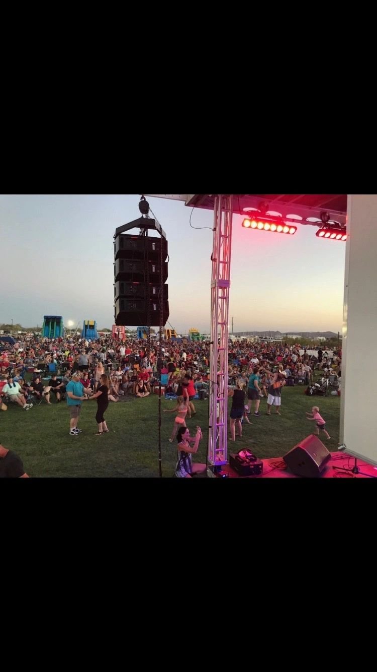 Outdoor stage and rigging seen from the field