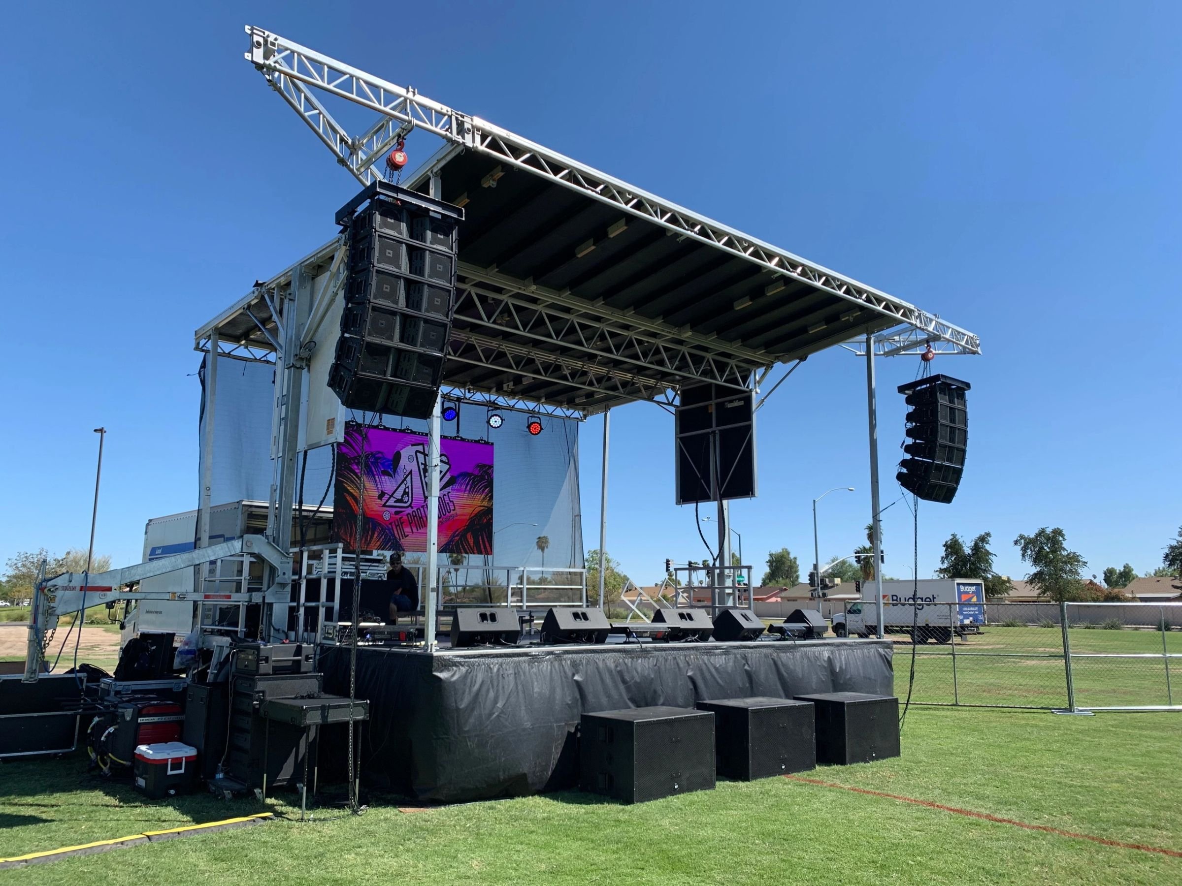Wide view of a Liven Productions stage and lighting rig